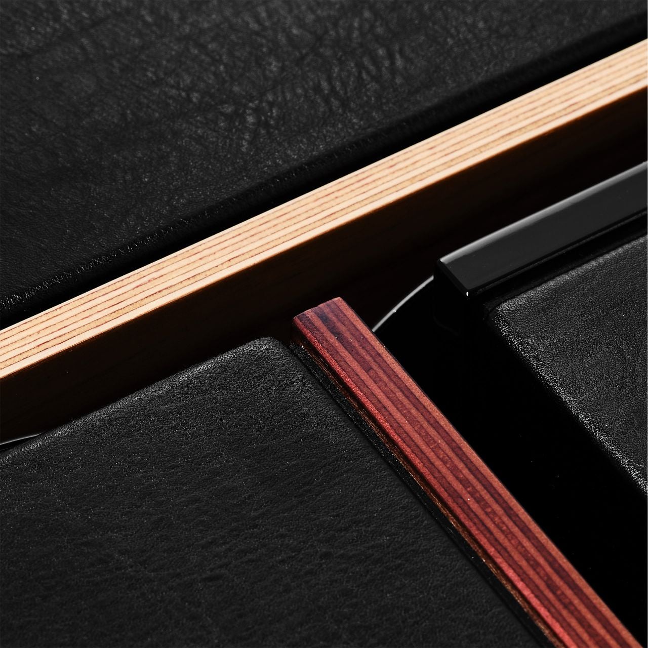 A detail of the layered wood and leather on Sonus faber lumina speakers