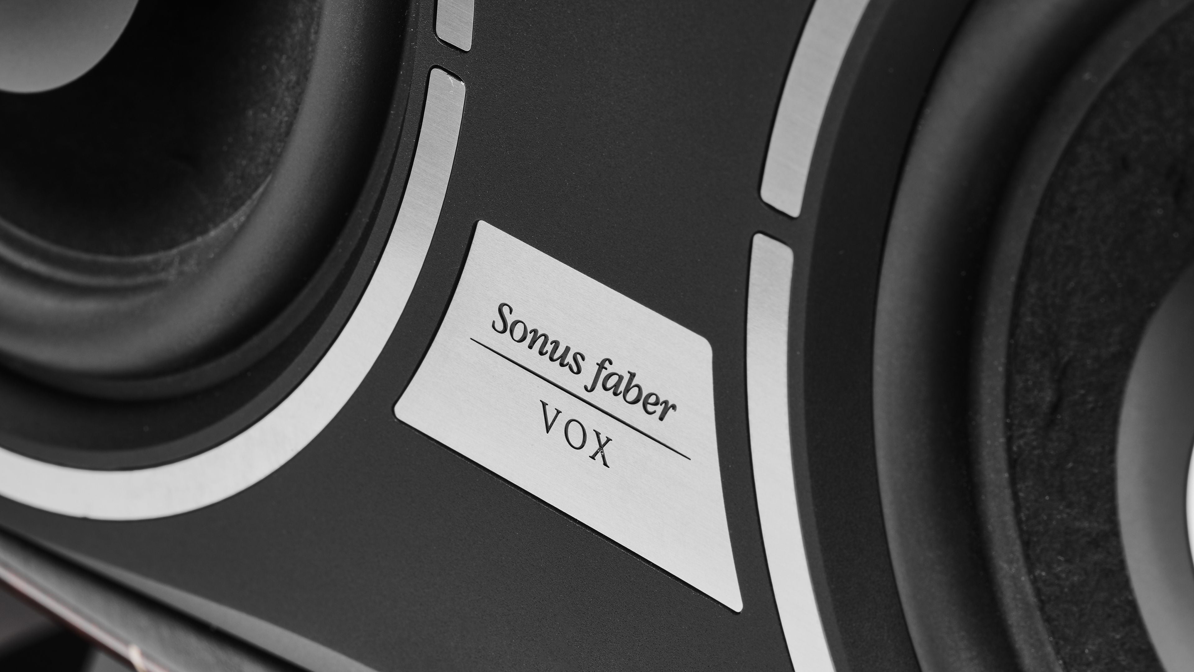 Close-up of Sonus faber Vox G3 home cinema speaker, highlighting the distinctive Sonus faber logo.